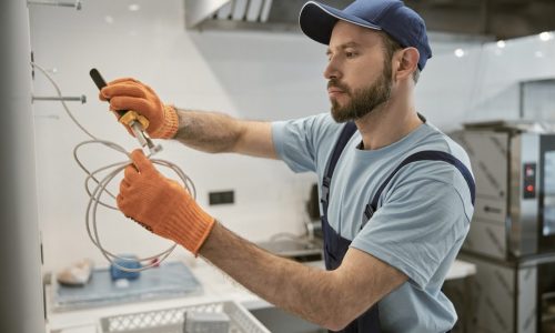 male-electrician-repairing-electric-cable-with-pliers.jpg